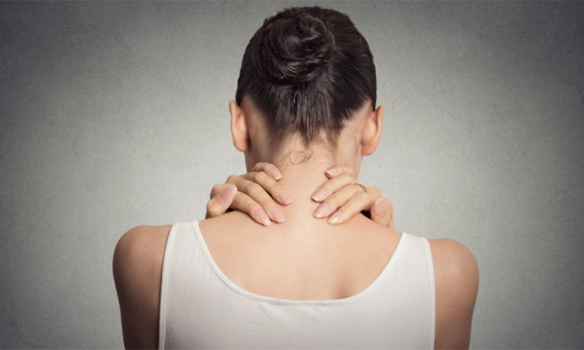 women holding neck with pain from Fibromyalgia/Neuritis